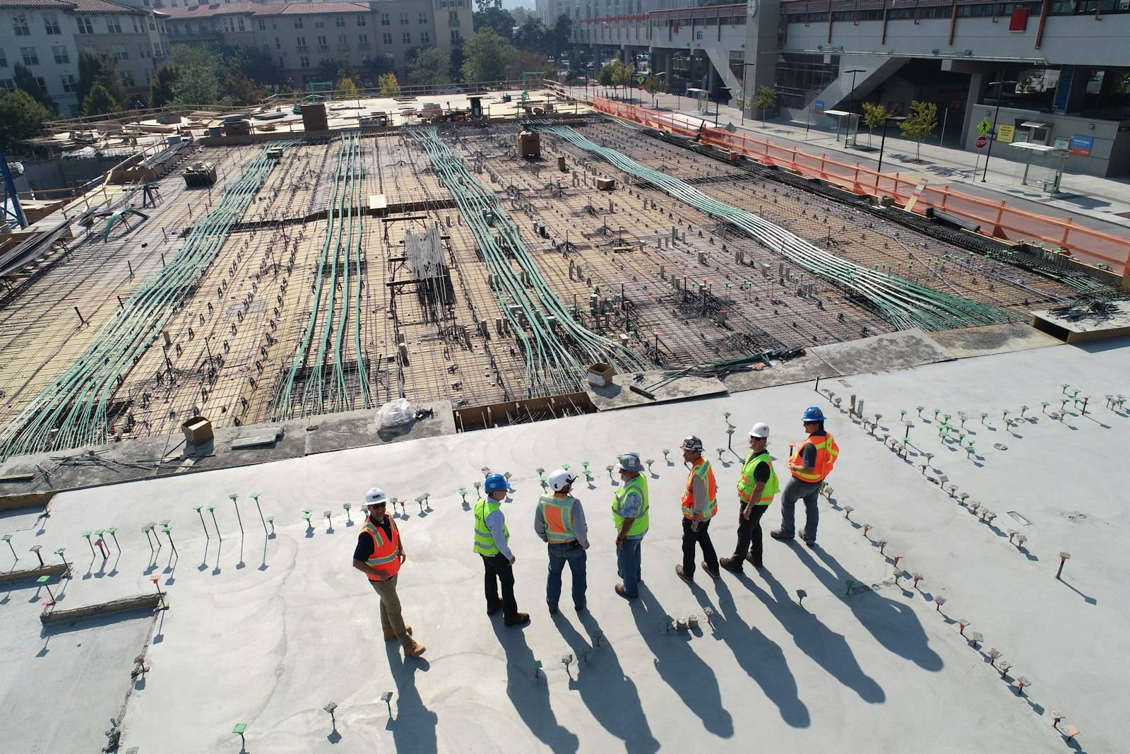 Materials and crews staged on a warm Southwest canyon jobsite